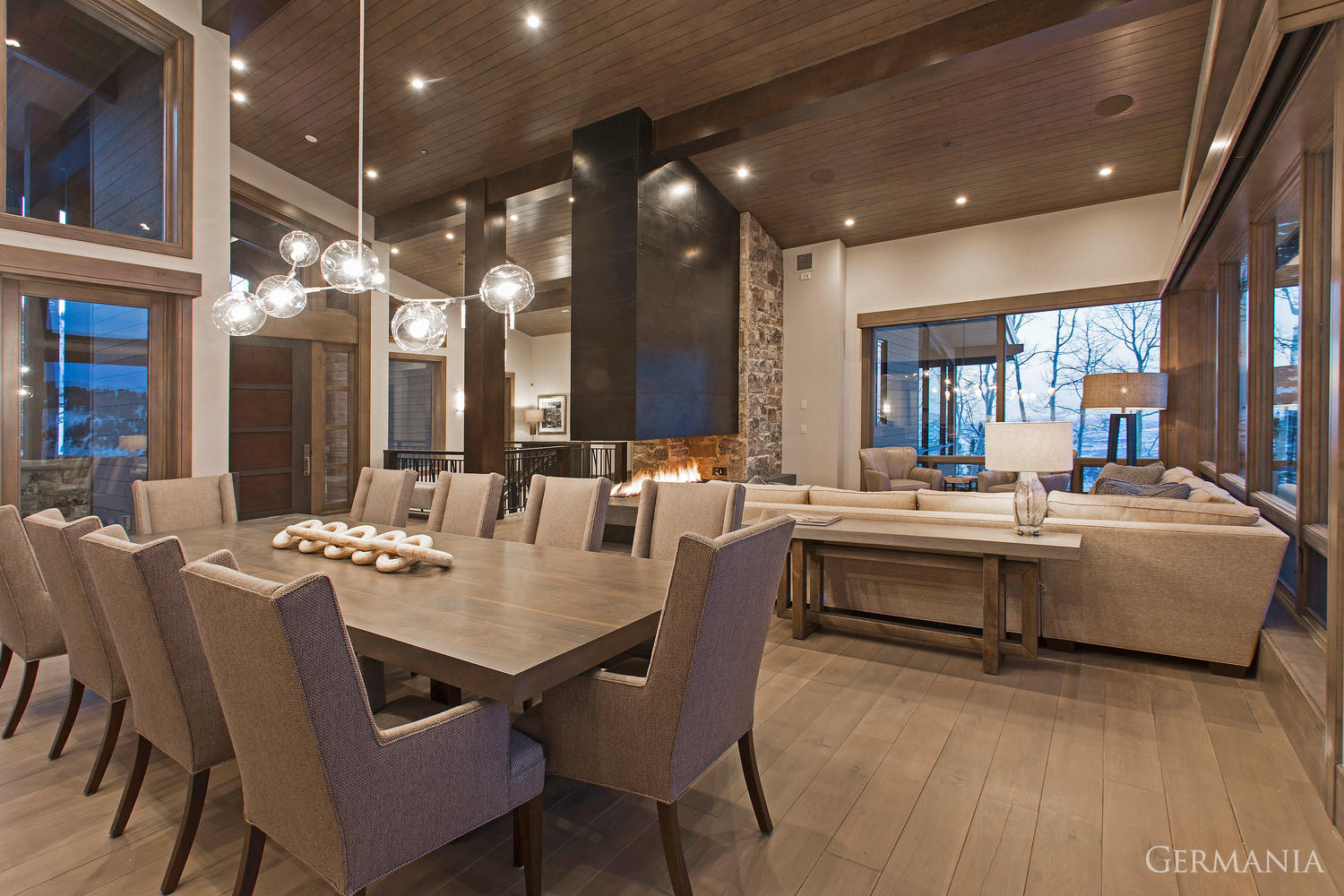 When building your custom house dining room, consider all the essential elements to maximize mountain living. Proper light fixtures and carefully design beams can augment any view!