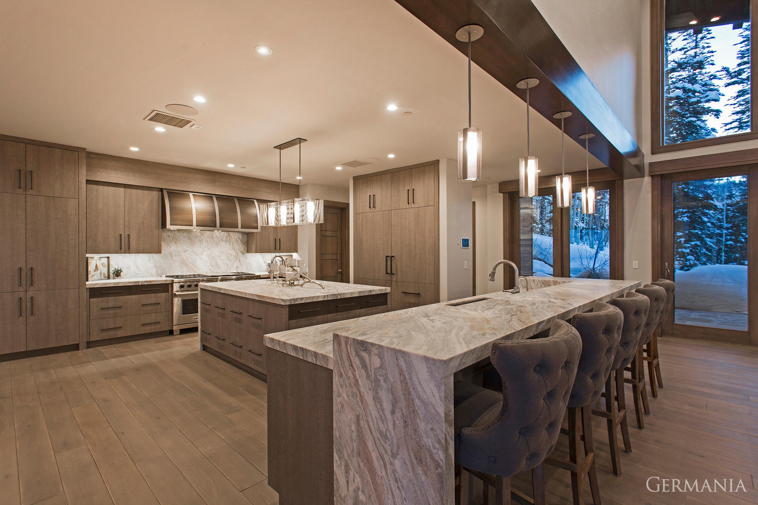 From the stone slab countertops to the meticulously designed wood floors, Germania Constructions custom house design for your kitchen brings mountain living to life.