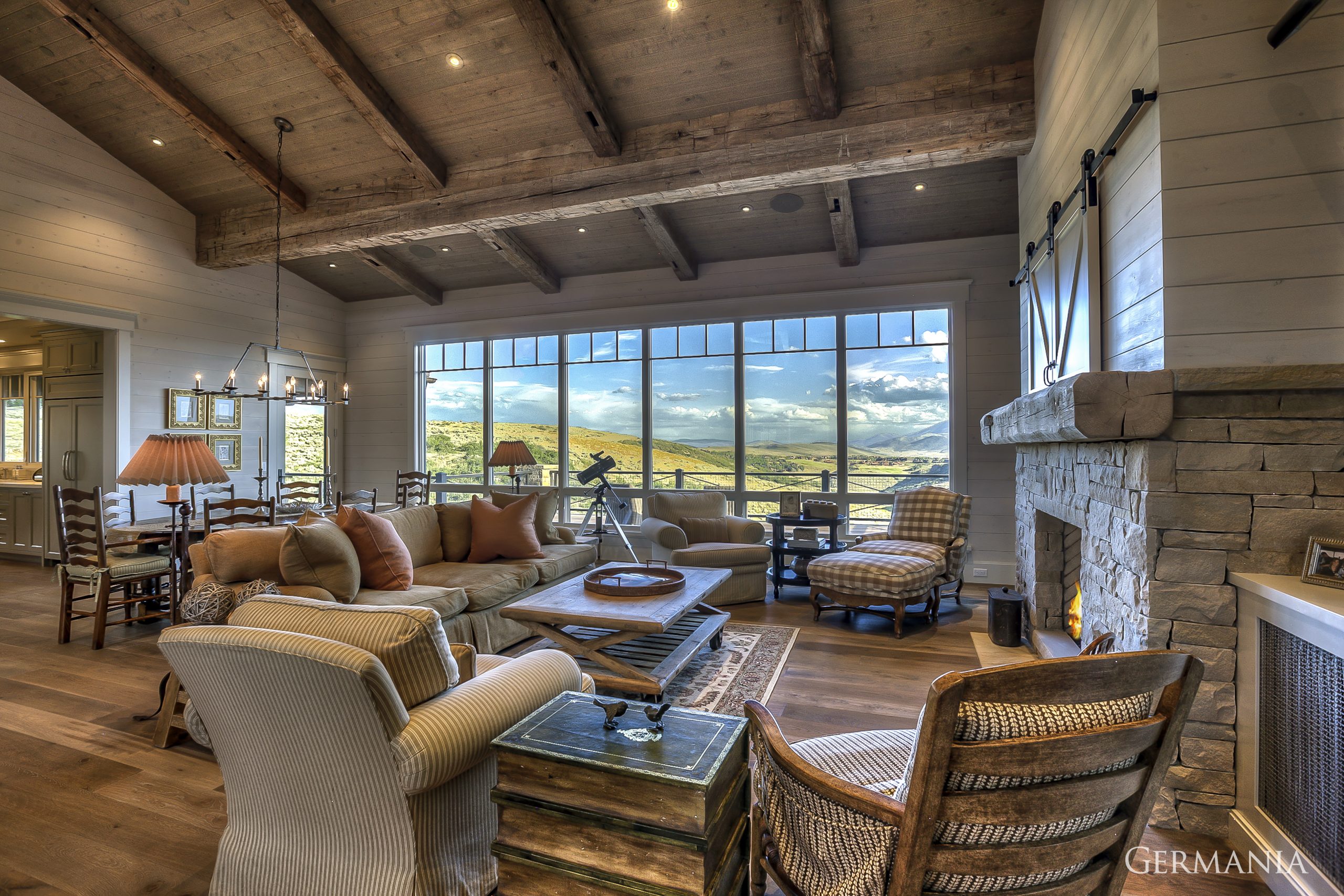 When it comes to luxury home living rooms, we pay attention to every minute detail. From tongue and groove ceilings with rustic looking beams to the fireplace and wood floors, Germania Construction are masters at the craft.