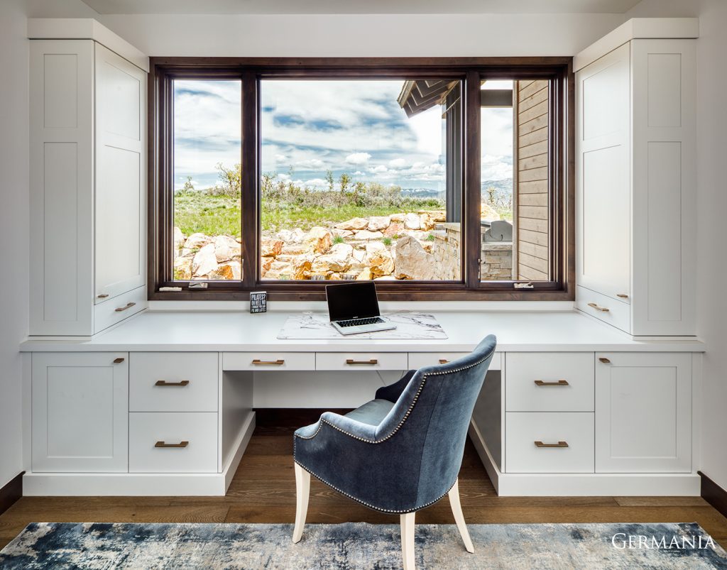 How about this for an office view? Nestled in the beautiful country of Kamas Utah, one can appreciate the custom cabinetry work and beautiful large windows for this office study.