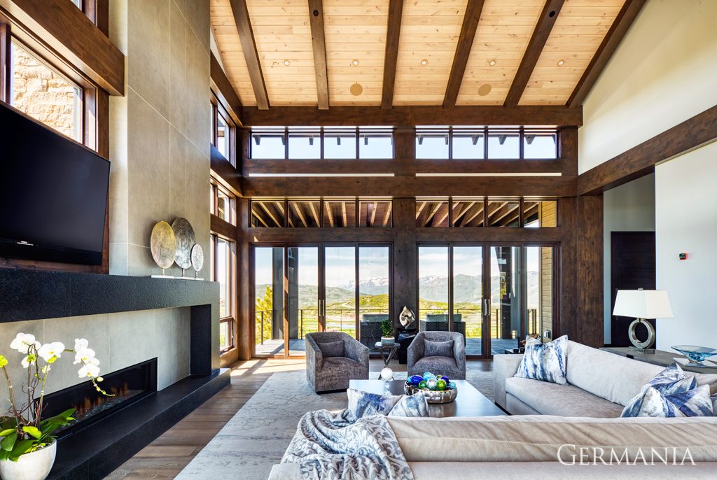 With this custom luxury home living room, pay close attention to the tongue and groove ceilings, the fireplace, wood beams, and more. The level of detailed perfectionism is easily noticed.