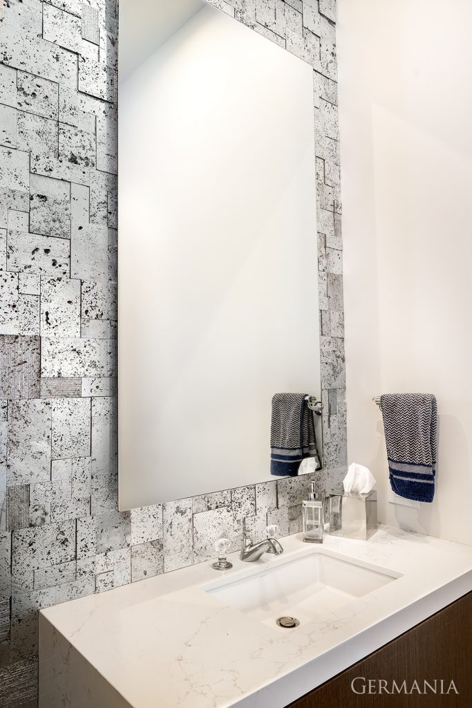 A textured wall adds interest and style to this bathroom.