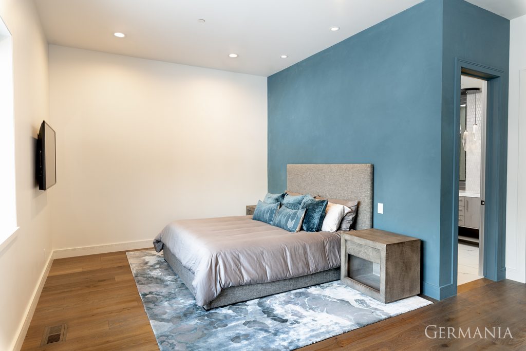 The blue accent wall gives this simple design a pop of fun color.