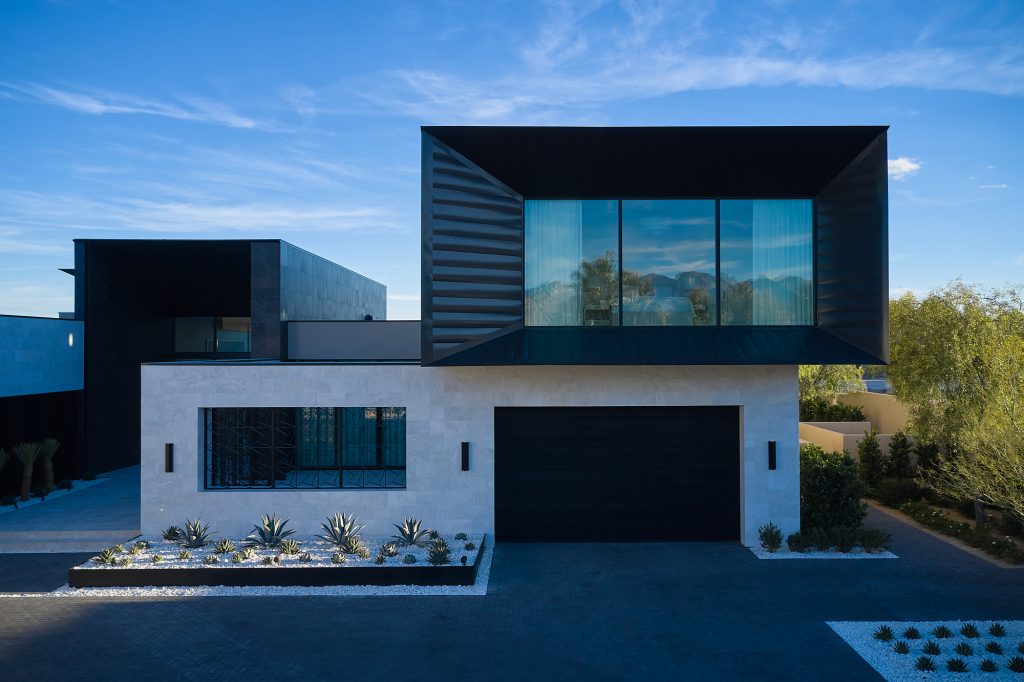The unique front elevation of this home is striking and modern.