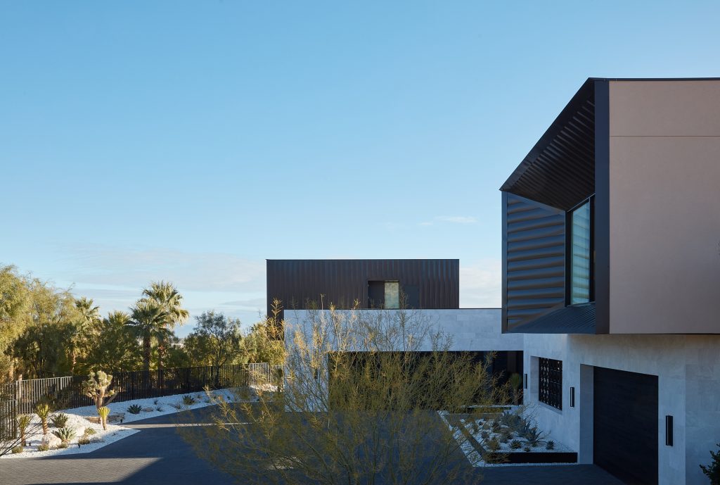 Modern industrial architecture make this home stand out amidst the desert surroundings.