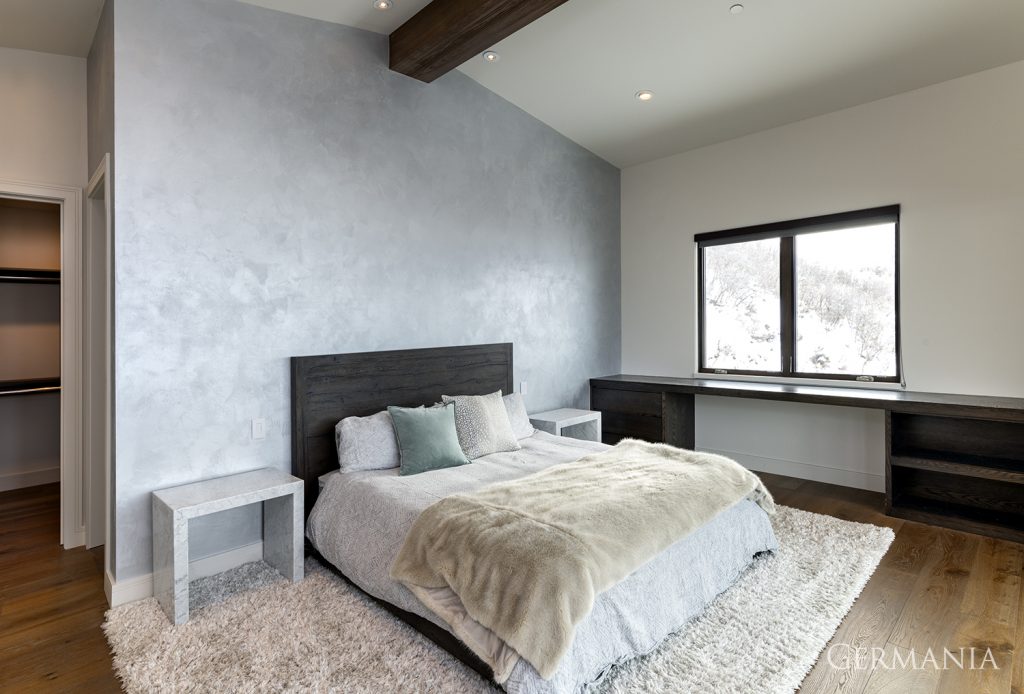 Beams and a wall feature are the simple touches that give this upstairs bedroom a unique look, while still keeping it simple and clean.