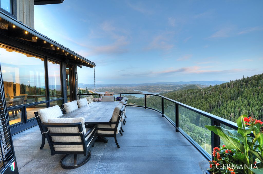 Stunning, luxury, custom-built deck in Park City, UT with amazing views of the mountains in summer time.