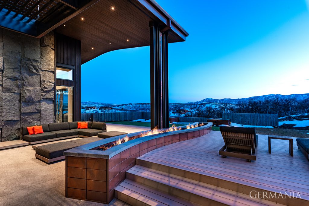 Luxury, custom-built deck in Park City, UT with beautiful mountain views and fire wall. 