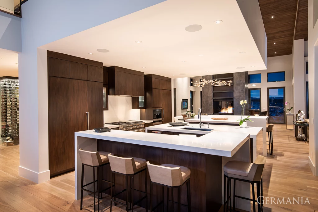 Each of these custom modern kitchens features some form of dark wood with clean, straight lines throughout. 