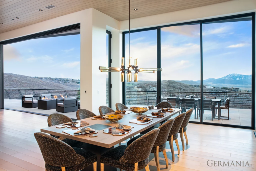 This modern dining room in Park City has a beautiful view.