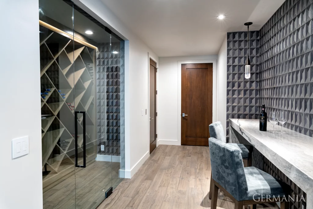 This temperature-controlled wine room and tasting area is the perfect setting to show off your collection and connect with friends while enjoying a glass of your favorite vintage.