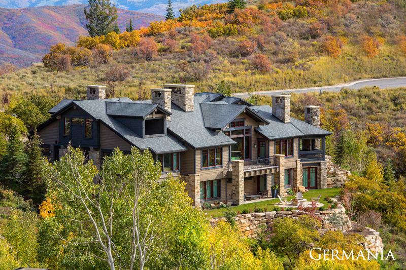 Luxury custom-built Park City, UT, home surrounded by orange and yellow fall leaves